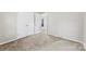 Spacious bedroom with neutral walls and carpeting featuring a closet and doorway at 1606 Northwoods Dr, Kings Mountain, NC 28086
