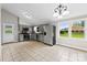 Bright kitchen with stainless steel appliances, gray cabinets, and tile flooring at 1606 Northwoods Dr, Kings Mountain, NC 28086