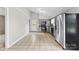 Updated kitchen with gray cabinetry, stainless steel appliances, and tile flooring under a vaulted ceiling at 1606 Northwoods Dr, Kings Mountain, NC 28086
