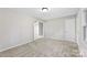 Spacious room featuring neutral walls and carpets with views to a hallway and doorway at 1606 Northwoods Dr, Kings Mountain, NC 28086
