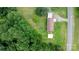 Aerial view of a property with a house, sheds, surrounded by lush greenery at 1691 Hill River Rd, Hiddenite, NC 28636