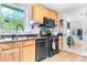 Functional kitchen with wooden cabinetry, modern appliances, and ample counter space at 1691 Hill River Rd, Hiddenite, NC 28636