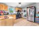 Spacious kitchen featuring stainless steel refrigerator and ample storage, open layout at 1691 Hill River Rd, Hiddenite, NC 28636