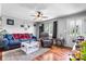 Bright living room with hardwood floors, comfortable seating, and natural light at 1691 Hill River Rd, Hiddenite, NC 28636