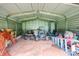 View of an outdoor shed with equipment and tools inside, providing extra storage at 1691 Hill River Rd, Hiddenite, NC 28636
