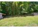 Spacious backyard with a shed and bamboo, offering privacy and a beautiful outdoor space at 185 Eastcliff Se Dr, Concord, NC 28025