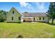 Backyard featuring a lovely patio, grassy area, and shade trees at 185 Eastcliff Se Dr, Concord, NC 28025