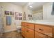 Bathroom with a wooden vanity, framed pictures, and tile floors at 185 Eastcliff Se Dr, Concord, NC 28025