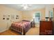 Cozy bedroom with quaint decor, ceiling fan, and natural light at 185 Eastcliff Se Dr, Concord, NC 28025