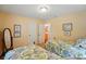 Cozy bedroom featuring two twin beds with floral bedding and ensuite bathroom at 185 Eastcliff Se Dr, Concord, NC 28025