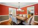 Traditional dining room featuring hardwood floors, a wooden table with seating for six, and an elegant chandelier at 185 Eastcliff Se Dr, Concord, NC 28025