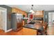 Kitchen with island, stainless steel appliances, and wooden cabinetry at 185 Eastcliff Se Dr, Concord, NC 28025