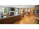 Open-concept living room with a fireplace that flows into the kitchen area at 185 Eastcliff Se Dr, Concord, NC 28025
