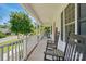 Inviting front porch with rocking chairs, perfect for relaxing and enjoying the outdoors at 185 Eastcliff Se Dr, Concord, NC 28025