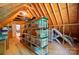 Unfinished attic with wood beams and a storage system at 185 Eastcliff Se Dr, Concord, NC 28025