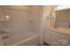 Bright bathroom with white cabinets, a shower and bath combination, and modern fixtures at 1922 Highland Park Dr, Charlotte, NC 28269