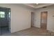 Bedroom with tray ceiling, neutral carpet, white walls, and natural light at 1922 Highland Park Dr, Charlotte, NC 28269