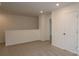 Upstairs loft area with neutral carpet, white walls, and an open doorway at 1922 Highland Park Dr, Charlotte, NC 28269