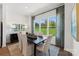 Dining area featuring modern furnishings, neutral decor, and large picture window view at 1944 Westerhill Dr, Fort Mill, SC 29708