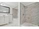 Bathroom with a vanity, mirror, tub with white marbled tile surround, and shower with glass door at 2315 Circle Dr, Great Falls, SC 29055