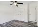 Bright bedroom with modern floors, a ceiling fan, and ample closet space at 2315 Circle Dr, Great Falls, SC 29055