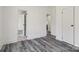 Hallway with modern flooring and access to multiple rooms at 2315 Circle Dr, Great Falls, SC 29055
