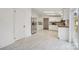 Modern kitchen with stainless steel appliances, ample cabinet space, and stylish tile floors at 2315 Circle Dr, Great Falls, SC 29055