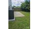Backyard lawn with concrete patio against wood fence and green bushes at 2924 Sedona Pl, Fort Mill, SC 29708