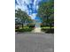 Charming two-story home featuring a well-manicured lawn, a single-car garage, and mature trees at 2924 Sedona Pl, Fort Mill, SC 29708