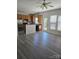 Open-concept kitchen with stainless steel refrigerator, wood cabinets and plenty of natural light at 2924 Sedona Pl, Fort Mill, SC 29708