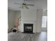 Cozy living room with a fireplace, a ceiling fan and wood stairs at 2924 Sedona Pl, Fort Mill, SC 29708
