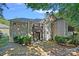 Private backyard with a wood balcony, rock border, mature trees, and well-maintained lawn offering serene views at 3308 Selwyn Farms Ln # 5, Charlotte, NC 28209