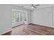 Inviting bedroom features a ceiling fan, hardwood floors, and a large bay window offering plenty of natural light at 3308 Selwyn Farms Ln # 5, Charlotte, NC 28209