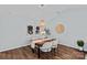 Comfortable dining area with stylish pendant lighting, decorative wall art, and seating for four guests at 3308 Selwyn Farms Ln # 5, Charlotte, NC 28209