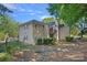 Well-maintained home exterior with mature landscaping, green lawn, private balcony, and easy access to parking at 3308 Selwyn Farms Ln # 5, Charlotte, NC 28209