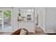 Efficient and modern kitchen with white cabinetry, stone countertops, stainless appliances, and breakfast bar at 3308 Selwyn Farms Ln # 5, Charlotte, NC 28209