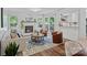 Bright living room with fireplace, hardwood floors, and a sliding glass door to a patio at 3308 Selwyn Farms Ln # 5, Charlotte, NC 28209