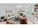 Cozy living room features a fireplace, plush seating, wood flooring, and natural light from the windows at 3308 Selwyn Farms Ln # 5, Charlotte, NC 28209