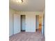 Neutral bedroom with an open closet, a doorway, and neutral colored carpet at 4009 Lawnview Dr, Charlotte, NC 28269