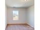 Cozy bedroom with carpet flooring and a window offering natural light at 4009 Lawnview Dr, Charlotte, NC 28269