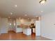 Open-concept kitchen and living area with hardwood floors and recessed lighting at 4009 Lawnview Dr, Charlotte, NC 28269