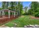 Lush backyard featuring a gazebo and putting green, perfect for outdoor activities and relaxation at 4189 Island Fox Ln, Denver, NC 28037
