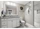 Bright bathroom with white cabinets, granite countertops, and a stylish shower with elegant tile at 4189 Island Fox Ln, Denver, NC 28037