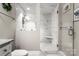 Modern bathroom with marble tile shower, a glass enclosure, and elegant fixtures at 4189 Island Fox Ln, Denver, NC 28037