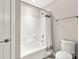 Simple bathroom featuring a shower-tub combo, white shower curtain, and essential fixtures at 4189 Island Fox Ln, Denver, NC 28037