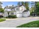 Stately home featuring a three-car garage, well-manicured landscaping, and a boat for outdoor adventures at 4189 Island Fox Ln, Denver, NC 28037