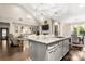 Stylish kitchen with granite counters open to a living room at 4189 Island Fox Ln, Denver, NC 28037