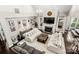 Open-concept living room featuring vaulted ceilings, a fireplace, and stylish furnishings at 4189 Island Fox Ln, Denver, NC 28037