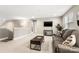 Cozy living room featuring a comfortable couch, modern TV, and neutral color palette at 4189 Island Fox Ln, Denver, NC 28037