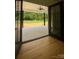 Bright sunroom featuring hardwood floors, ceiling fan, and view to outdoors at 420 Sloop St, China Grove, NC 28023